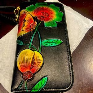 Woman’s wristlet/clutch with vibrant color flowers